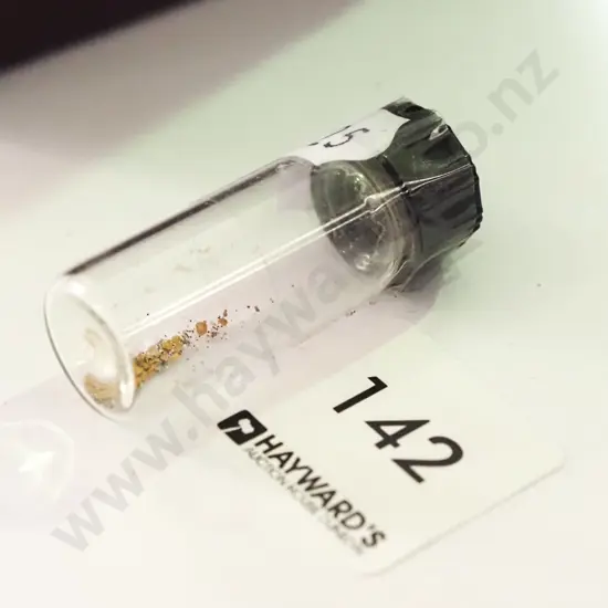 small canister of alluvial gold