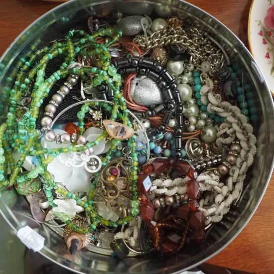 tin of costume jewellery