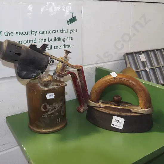 sad iron and a brass blow torch