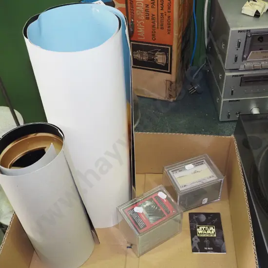 box of Star Wars posters and card games