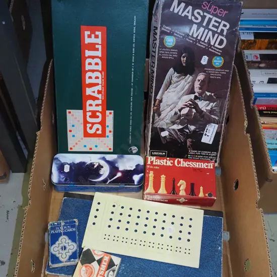 box of board games - Scrabble, Mastermind, chess, etc
