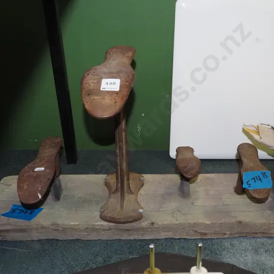 5x shoe lasts on wooden board