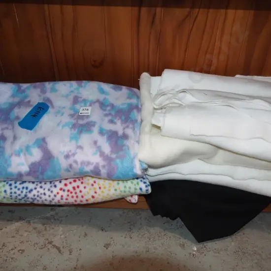 various pieces of polar fleece, black fabric