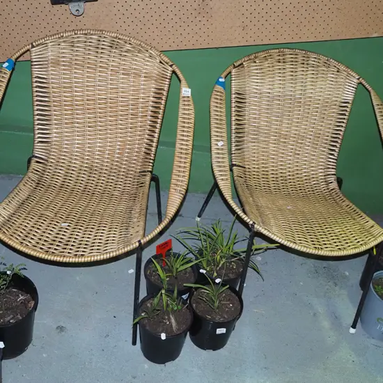 pair of matching mid century woven plastic armchairs