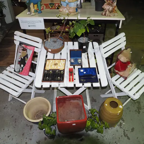white painted wooden foldaway outdoor table with 2 chairs
