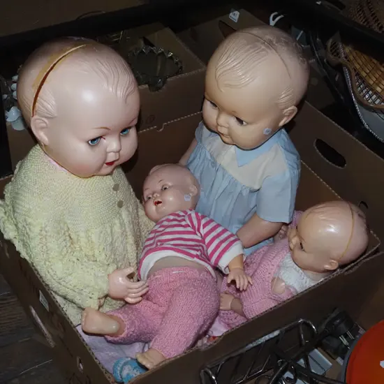 box of vintage dolls