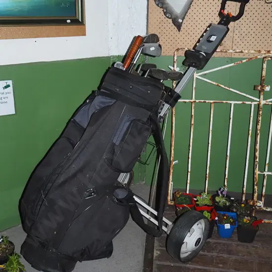 golf clubs and trundler