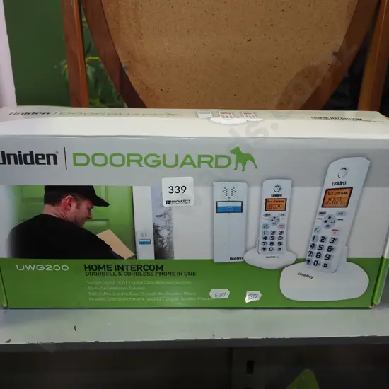 box; Uniden door bell, cordless phone in one