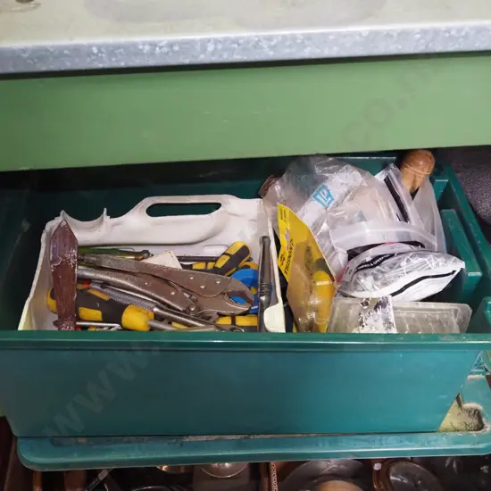 green plastic tub of hand tools; nails etc