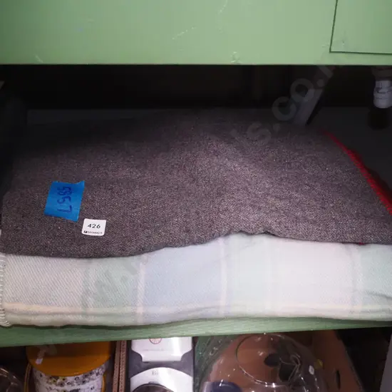 grey woollen and checked blankets