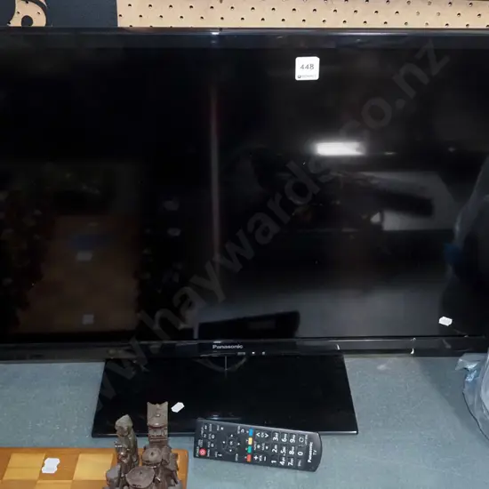 Panasonic 32" flat screen TV with bag of additional items