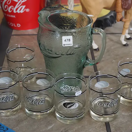 large Coca Cola water jug and 6 tumblers