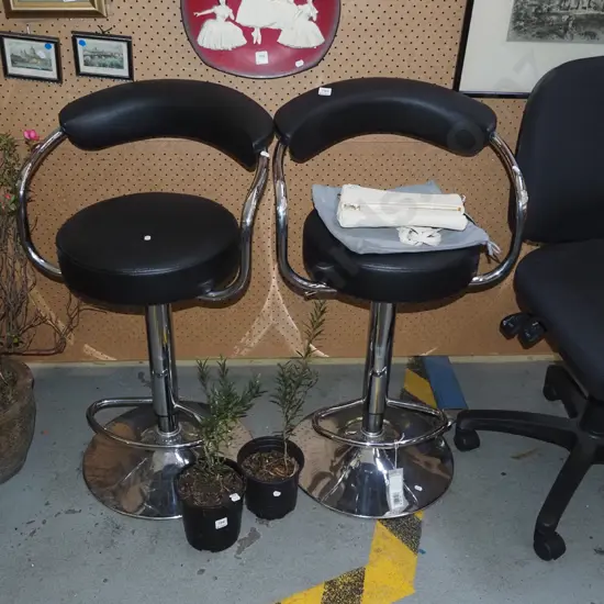 pair of chrome and vinyl bar stools