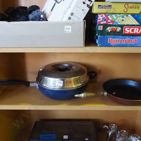 2 frying pans, one with stainless steel lid