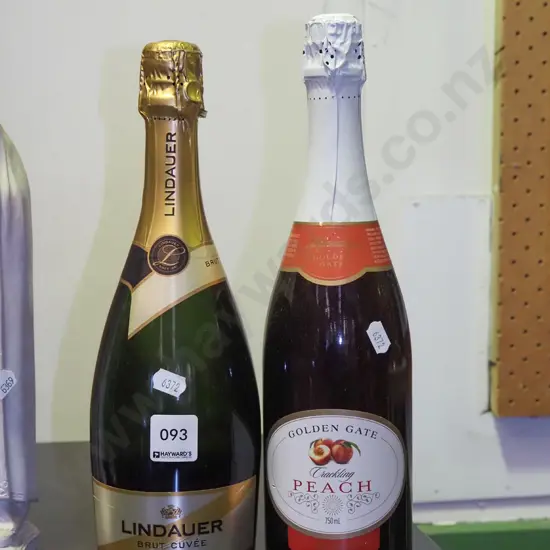 bottle of wine, bottle of sparkling peach juice