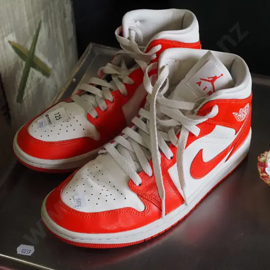 pair of size US 9 red and white Nike Air Jordans