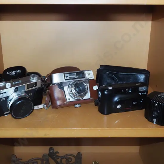3x 35mm film cameras and a vintage box Brownie