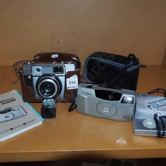 Agfa leather cased camera, Canon 35mm camera, small FM/Am radio