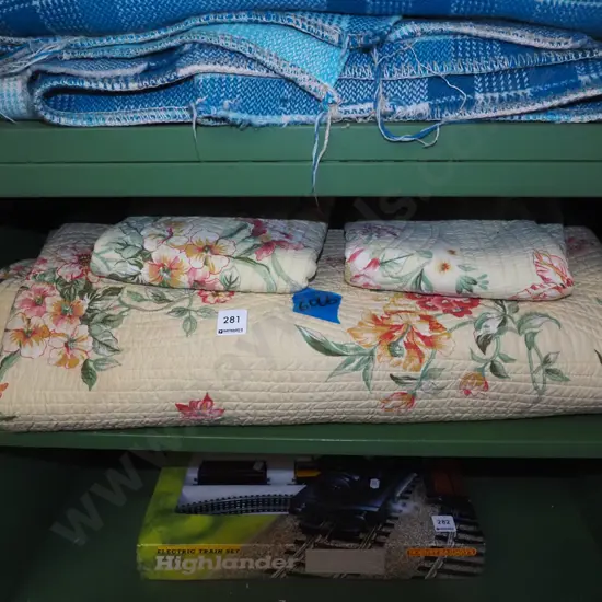 yellow floral quilt and pillow cases