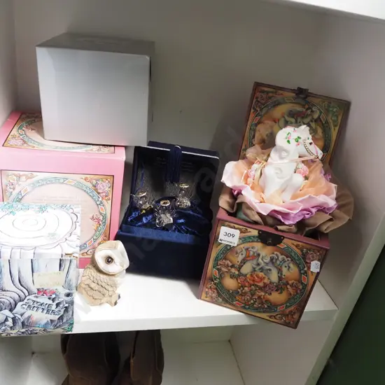 unicorn jack in the box, angel figurines, stone owl