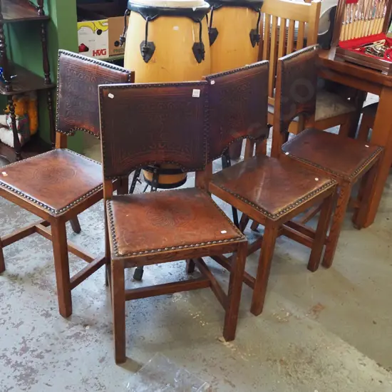 pair of 4 tooled leather and oak dining chairs with domes