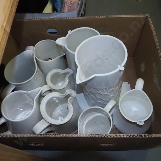 box of white jugs
