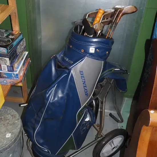 golf clubs and trundler