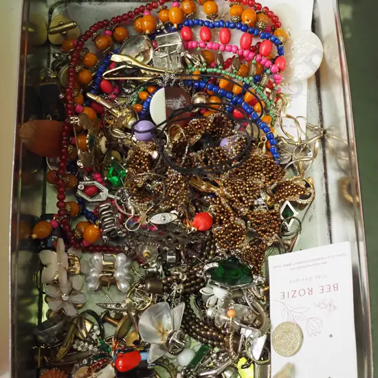 tin of costume jewellery
