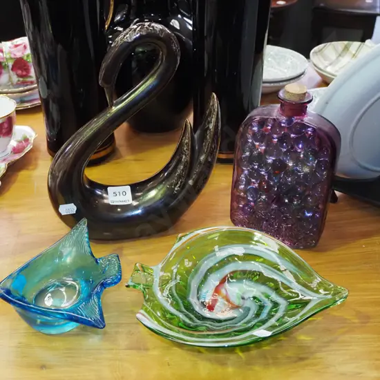 ornametal swan figurine, stoppered purple bottle, marbles etc