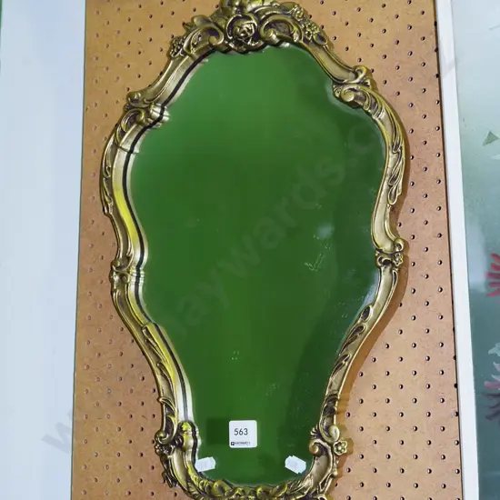 ornate gilt framed wall mirror
