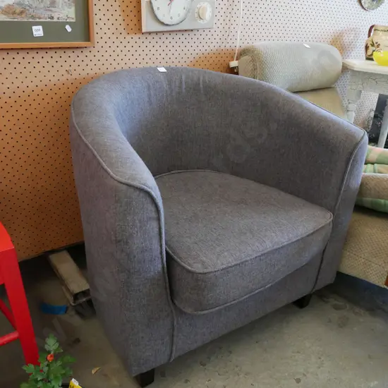 grey upholstered tub chair