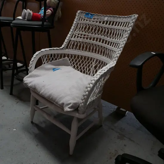 white painted woven cane patio chair