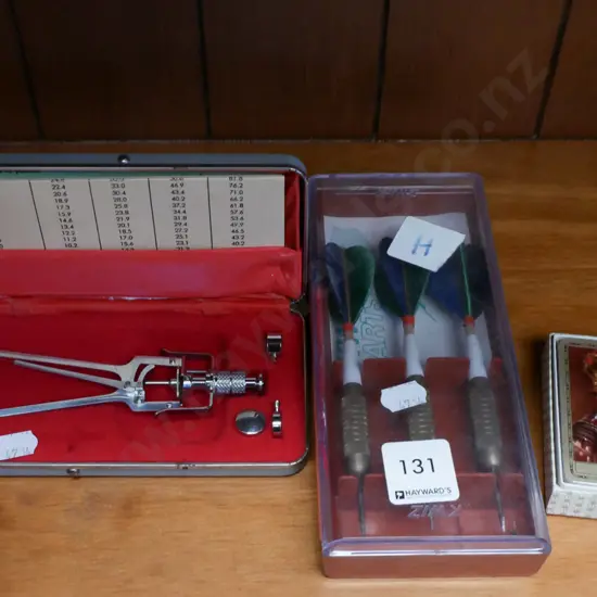 playing cards, darts, tonometer
