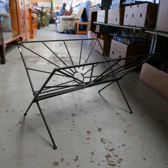 black metal magazine rack