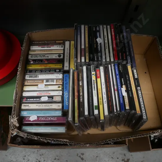 box of CDs and cassette tapes