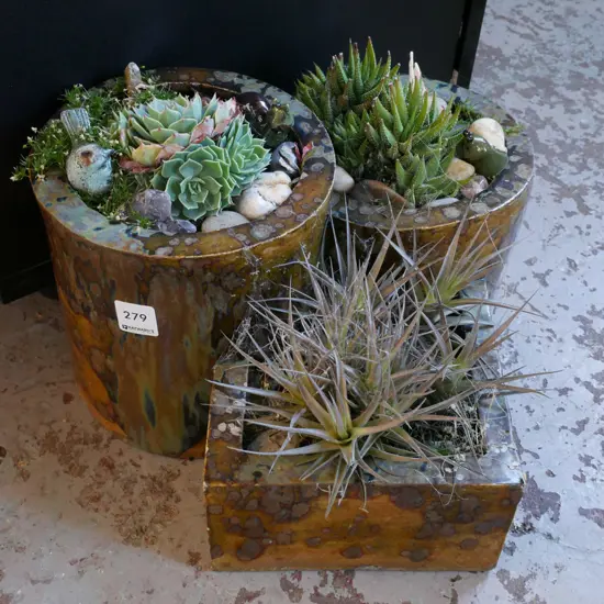 studio pottery planter with stones and succulents
