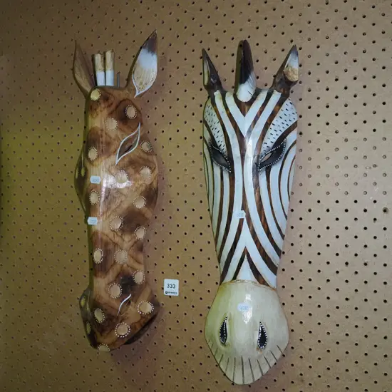 2x carved wooden masks 