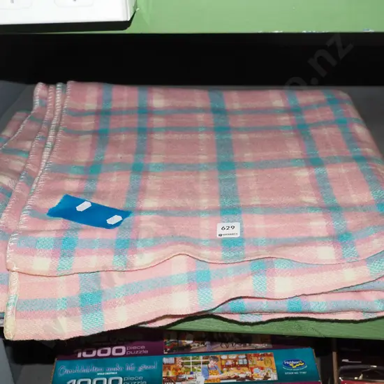 pink and blue checked woollen blanket