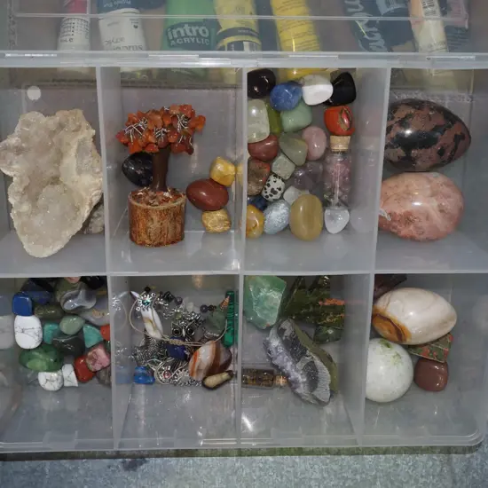 plastic organiser of polished stones, crystals etc
