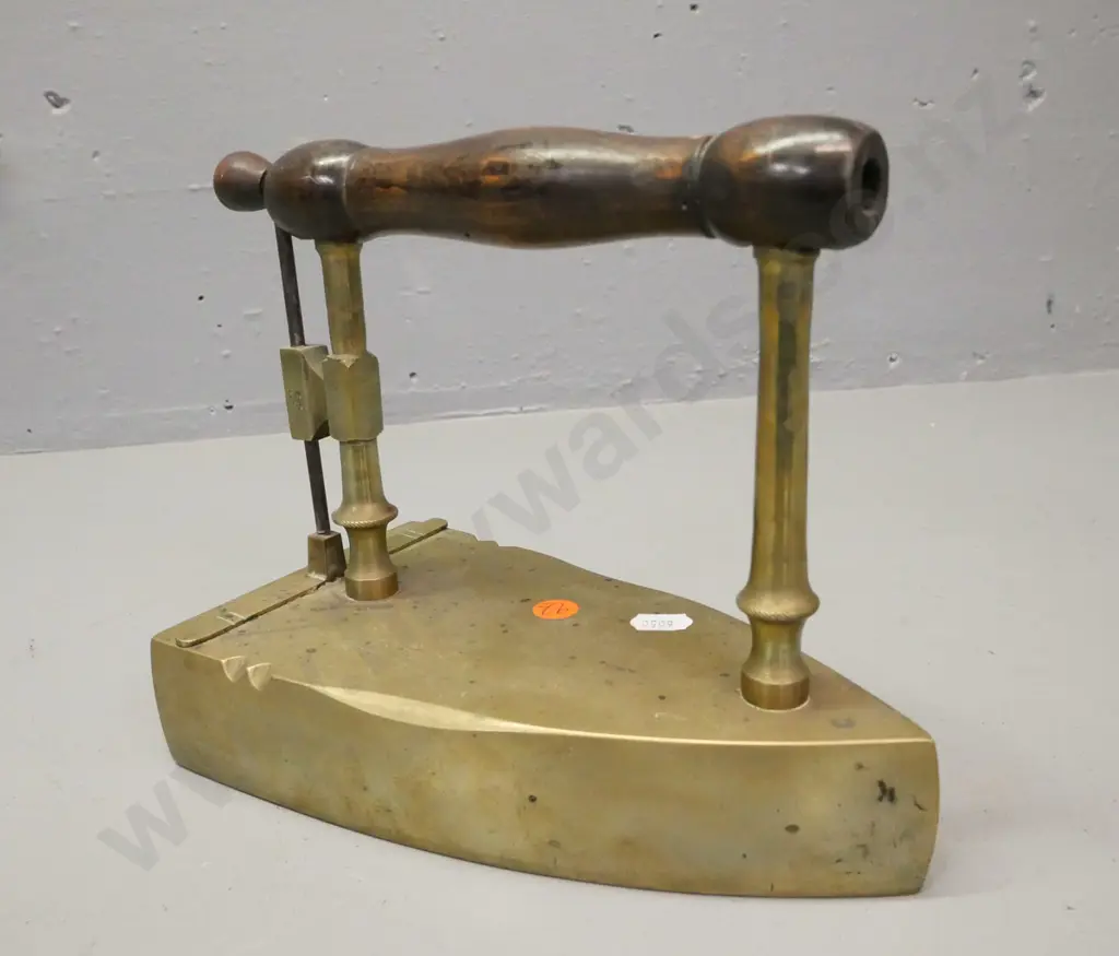 early brass flat coal iron. Turned wooden handle, lift up shutter. Some corrosion to surface H-190 W-220 Image 1++