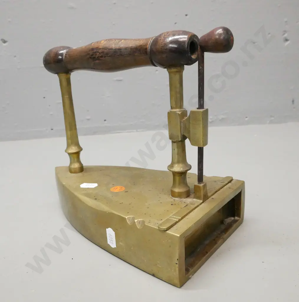 early brass flat coal iron. Turned wooden handle, lift up shutter. Some corrosion to surface H-190 W-220 Image 1++