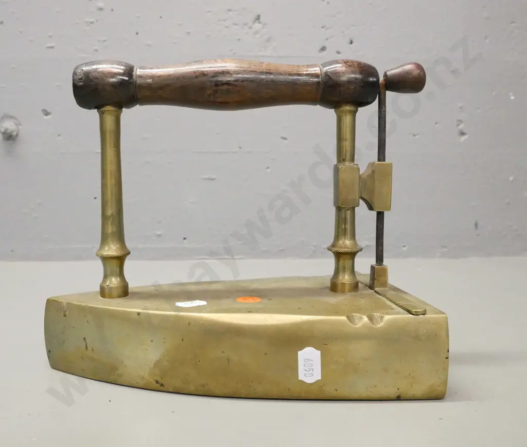 early brass flat coal iron. Turned wooden handle, lift up shutter. Some corrosion to surface H-190 W-220 Image 1++