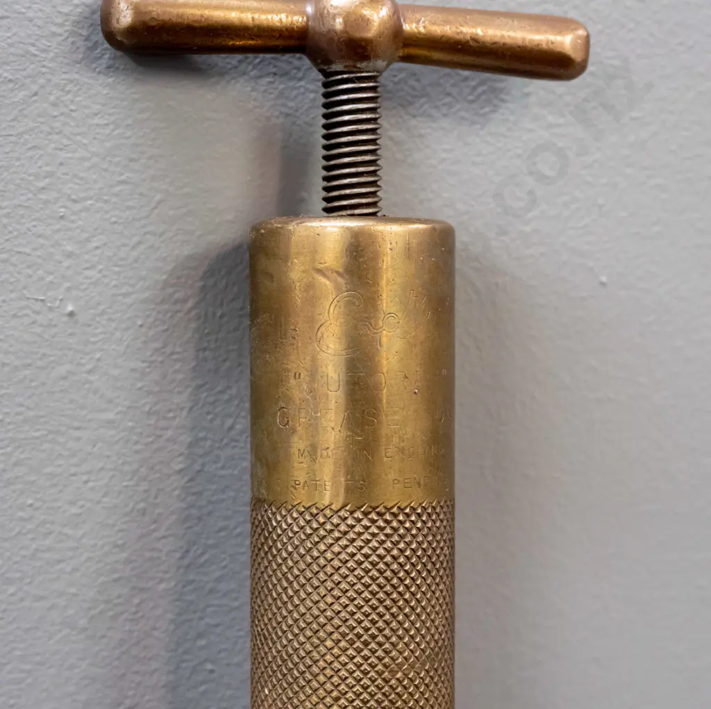vintage brass Enot's "Autoram" telescoping grease gun and a copper tank with half round profile, brass handle and cap Image 1++