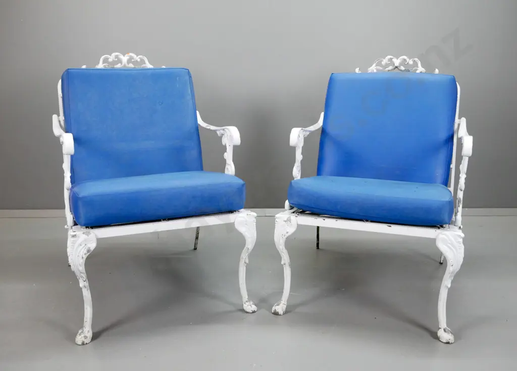 pair of cast alloy white painted patio lounge chairs with blue vinyl squabs - aging and discolouration to vinyl, arms Image 1++