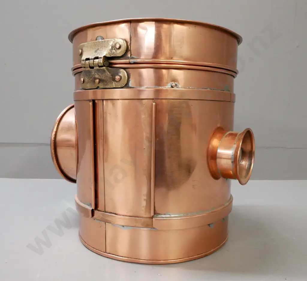 circular copper vintage lantern. Magnifying domed lens on one side, small lens opposite. Brass clasp. Image 1++