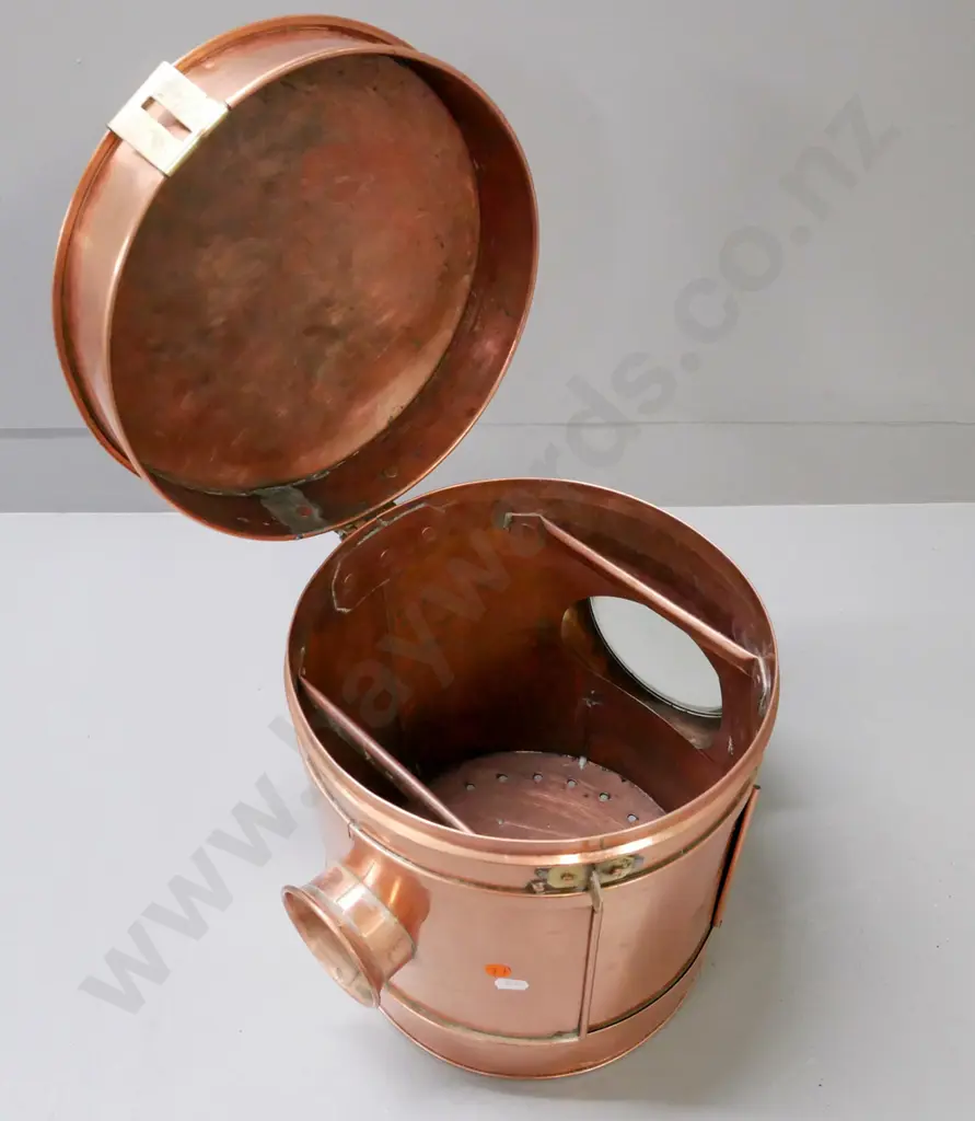 circular copper vintage lantern. Magnifying domed lens on one side, small lens opposite. Brass clasp. Image 1++