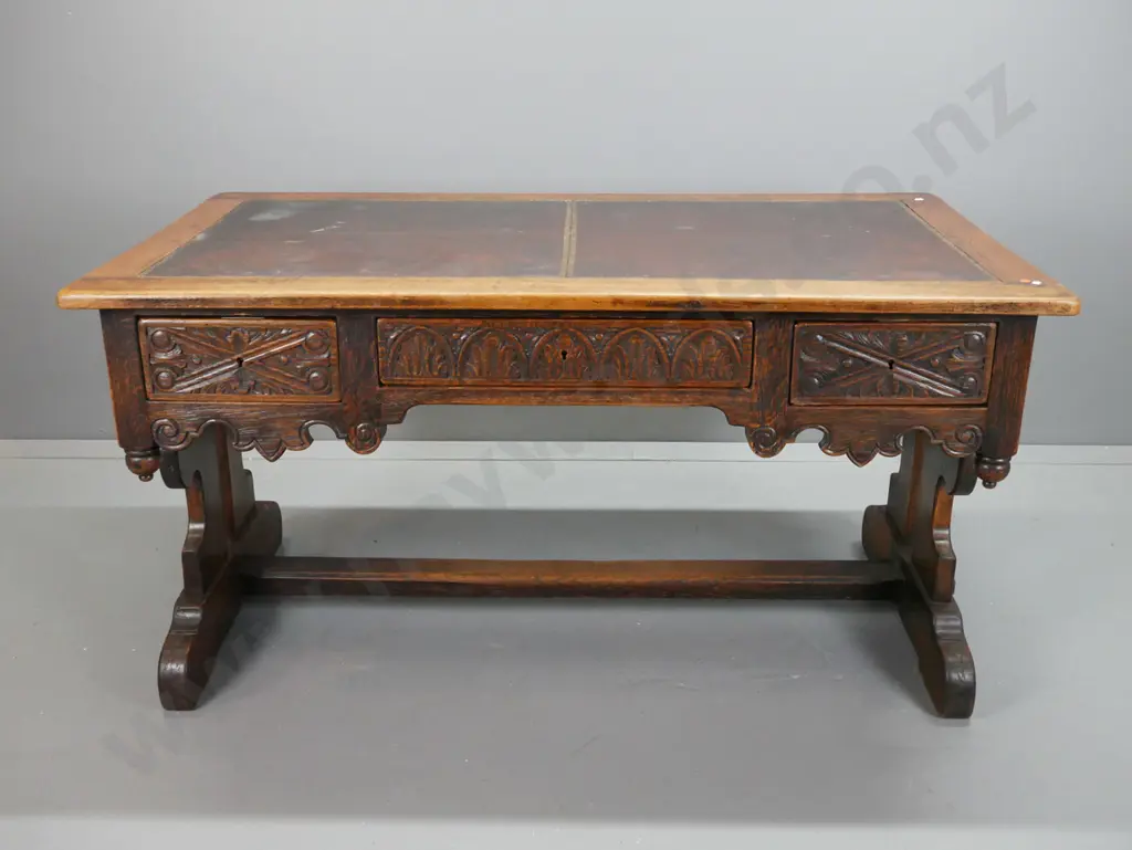 early 19th century European refectory based oak desk with carved lunettes and scroll work on sides and drawer fronts, Image 1++