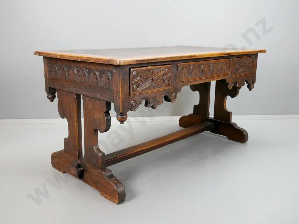 early 19th century European refectory based oak desk with carved lunettes and scroll work on sides and drawer fronts, Image 1++