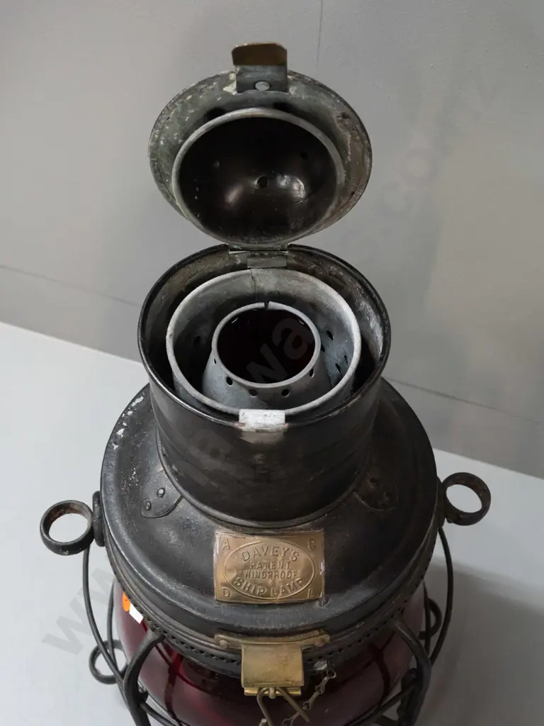 large ship's lantern with top and bottom handles, red glass bubble lens, w/ plaque: Davies Patent Windproof Ship Lamp. Image 1++