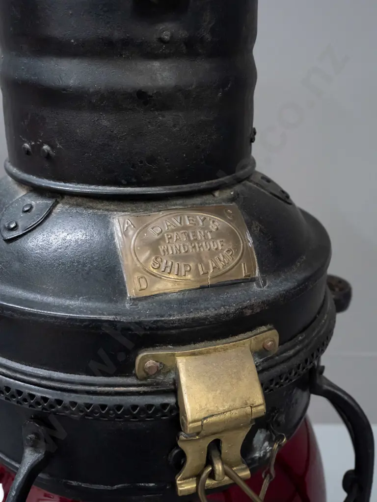 large ship's lantern with top and bottom handles, red glass bubble lens, w/ plaque: Davies Patent Windproof Ship Lamp. Image 1++